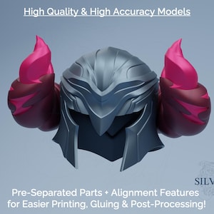Puede incluir: Un casco plateado y gris oscuro con dos protuberancias rosas en forma de llama. El texto "High Quality & High Accuracy Models" y "Pre-Separated Parts + Alignment Features for Easier Printing, Gluing & Post-Processing!" son visibles.