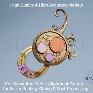 May include: A gold-colored, ornate, circular, decorative piece with three pink and orange circles inside. The piece has a floral design and is separated into parts for easier printing, gluing, and post-processing.