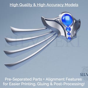 May include: A silver-colored, stylized decorative object with a blue gem and four curved, wing-like extensions. The text "High Quality & High Accuracy Models" is at the top. The text "Pre-Separated Parts + Alignment Features for Easier Printing, Gluing & Post-Processing!" is at the bottom.
