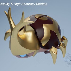 May include: A gold and brown beetle figurine with a detailed design. The beetle has a large, rounded body with a pointed head and long, sharp horns. The figurine is made of a smooth, shiny material.