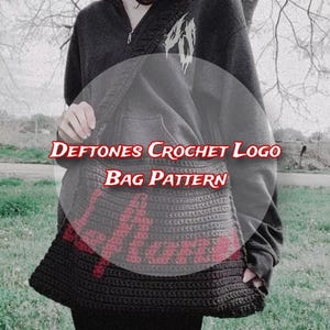 May include: A black crochet bag with a red logo and the text "Deftones Crochet Logo Bag Pattern". The bag is worn over the shoulder and has a textured appearance. The image is taken outdoors.