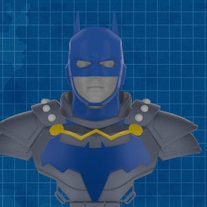 May include: A blue and grey Batman bust with a yellow accent on a blue grid background. The bust features a cowl with pointed ears, a bat symbol, and armoured shoulders. The design is a 3D render.