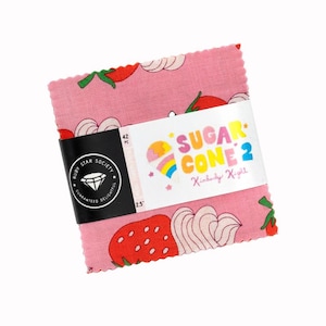 May include: A stack of pink fabric squares with a strawberry and whipped cream pattern. The fabric is wrapped with a black band featuring the Ruby Star Society logo and the text "SUGAR CONE 2". The fabric squares are 2.5 inches.