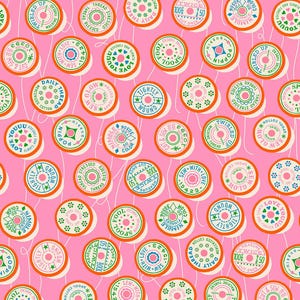 May include: A repeating pattern of sewing thread spools on a pink background. The spools are circular with various text and designs in green, blue, and orange. White thread lines connect the spools.