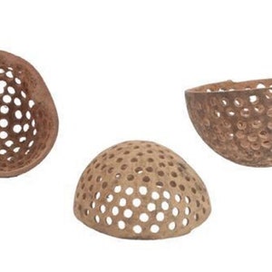May include: Three brown, round, wooden bowls with a decorative pattern of holes. The bowls are made from natural materials and have a rustic, handmade look.
