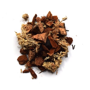 May include: A close-up of a pile of brown and beige bark chips, commonly used as a soil amendment or for decorative purposes.