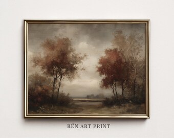 Può includere: Una stampa artistica paesaggistica in una sottile cornice dorata che raffigura una scena cupa di alberi con fogliame bruno-rossastro sotto un cielo nuvoloso. L'opera mostra un campo dai toni terrosi con il testo REN ART PRINT sottostante.