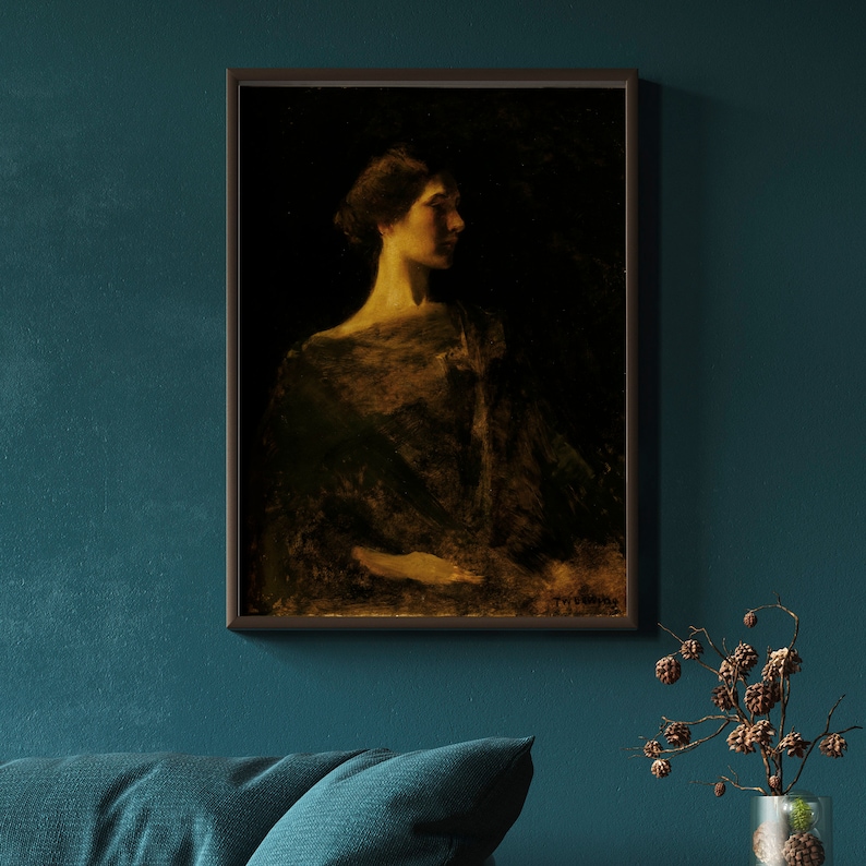 May include: Framed portrait of a woman in profile, rendered in muted tones of gold and black. The artwork, set against a dark background, features a woman with her hair up, wearing a draped garment. The painting is in a dark wooden frame.