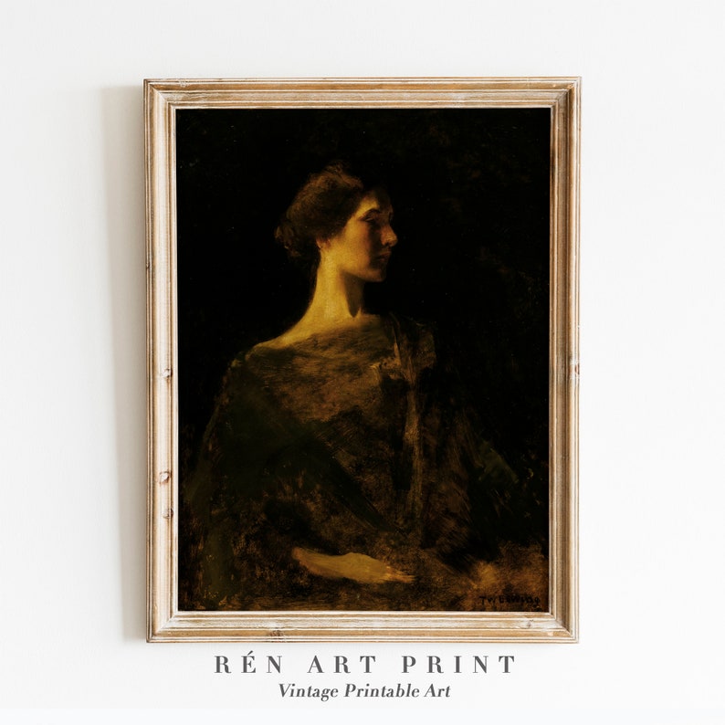 May include: Vintage art print of a woman in profile, rendered in dark tones with a golden glow on her face and shoulders. The artwork is framed in a light-colored wooden frame. The text "R&Eacute;N ART PRINT" and "Vintage Printable Art" are at the bottom.