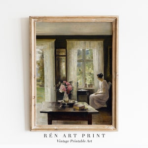 May include: A vintage painting depicting a woman seated in a chair by a window in a room with white curtains. The woman is wearing a white dress and gazing out of the window. A vase of flowers sits on a table in the foreground.