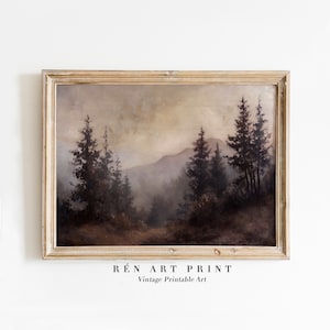 May include: A vintage landscape painting of a misty forest with tall pine trees and a mountain range in the background. The painting is framed in a light wood frame.