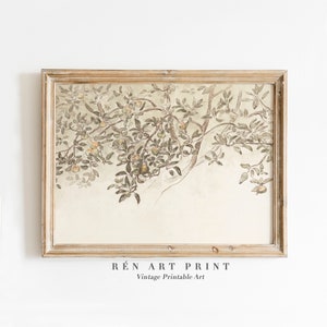 May include: A vintage watercolor painting of a tree branch with green leaves and small orange fruits. The painting is framed in a light wood frame and has a white background.