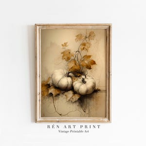 May include: A framed vintage art print featuring two white pumpkins with brown leaves and vines. The artwork has a sepia tone and the text "RÉN ART PRINT Vintage Printable Art" is at the bottom.