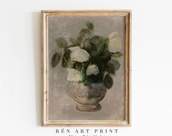 May include: A vintage painting of a bouquet of white roses in a blue and white vase. The painting is framed in a light wood frame.