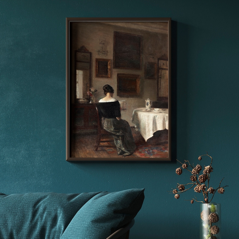 May include: A painting of a woman in a black dress sitting at a table in a room with a white tablecloth and a vase of flowers. The room is decorated with framed artwork and mirrors.