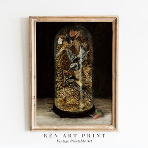 May include: A framed vintage art print depicting a glass cloche containing three detailed birds. The birds are set against a backdrop of golden foliage. The frame is light wood, and the print includes the text "RÉn ART PRINT Vintage Printable Art."