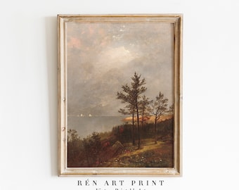 May include: A vintage landscape painting in a light wood frame. The painting depicts a seascape with a forest in the foreground and a cloudy sky. The painting is titled "RÉN ART PRINT Vintage Printable Art".