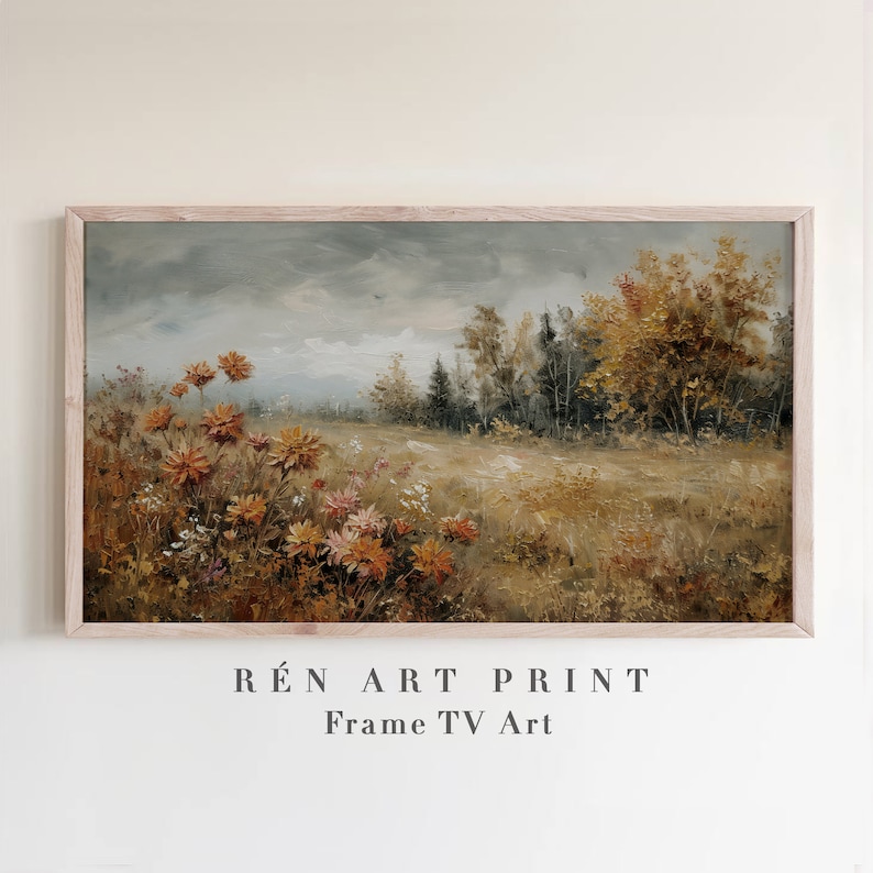 Puede incluir: Una pintura enmarcada que representa un paisaje con un campo de flores naranjas y amarillas en primer plano, un bosque en el fondo y un cielo nublado. La pintura se titula "R&Eacute;N ART PRINT Frame TV Art".