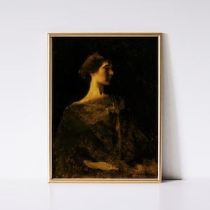 May include: A framed vintage portrait painting of a woman in profile, rendered in dark tones with a golden frame. The woman is illuminated from the side, highlighting her features and the draped fabric of her garment. The artwork evokes a sense of classic elegance.