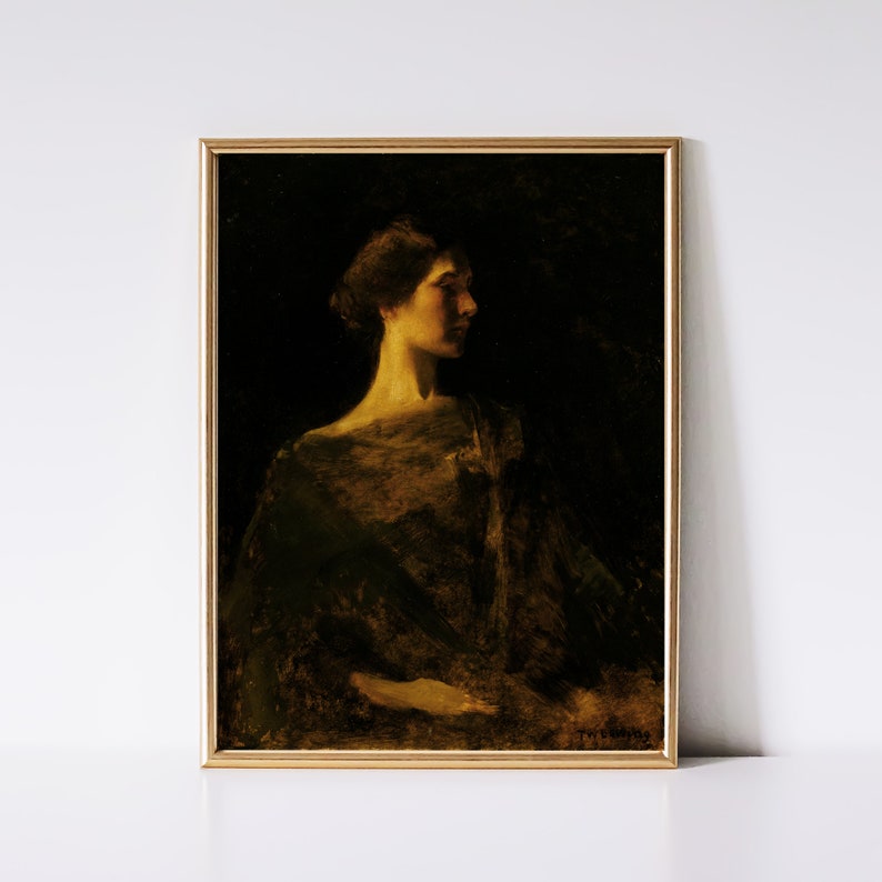 May include: A framed vintage portrait painting of a woman in profile, rendered in dark tones with a golden frame. The woman is illuminated from the side, highlighting her features and the draped fabric of her garment. The artwork evokes a sense of classic elegance.