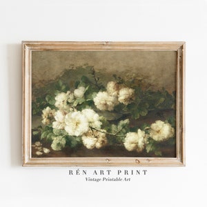 May include: A vintage painting of a bouquet of white roses with green leaves in a brown frame. The painting has a rustic, antique aesthetic.