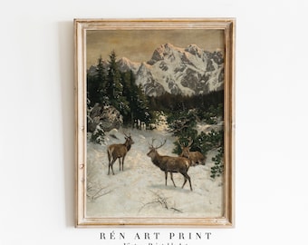 以下が含まれることがあります： 雪に覆われた山岳地帯の風景を描いたヴィンテージの絵画。手前に3頭の鹿が描かれている。絵画は明るい木製の額縁に入っている。