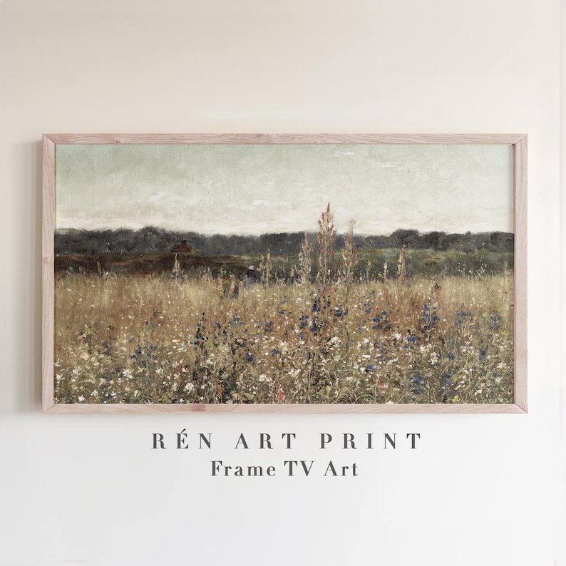May include: A framed landscape print featuring a field of tall grasses and wildflowers in shades of brown, green, and blue. The artwork has a vintage aesthetic, with a soft, muted color palette. The text "R&Eacute;N ART PRINT Frame TV Art" is at the bottom.