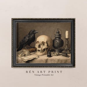 May include: A framed vintage print featuring a still life with a skull, a black raven, a candle, and a decorative lantern. The print has a dark, gothic aesthetic, with a neutral color palette. The text "R&eacute;n Art Print" and "Vintage Printable Art" is at the bottom.