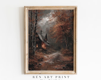 May include: A framed vintage print depicts a cabin nestled in a forest during autumn. The artwork features a cabin with lit windows, surrounded by trees with orange and brown leaves. The print includes the text "RÉN ART PRINT" and "Vintage Printable Art".
