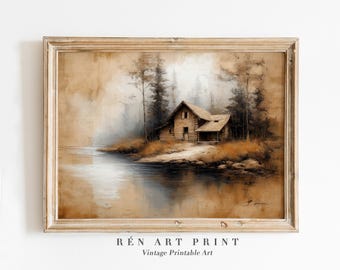 May include: A framed vintage print of a cabin on a lake. The artwork features a rustic cabin with a wooden exterior, surrounded by trees and water. The color palette includes browns, tans, and muted greens, creating a serene landscape.