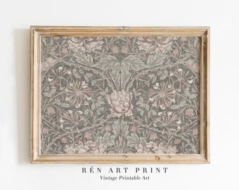 May include: A framed vintage print with a floral design in grey, pink, and green. The artwork displays a detailed botanical pattern with stylized flowers and leaves. The frame is a light gold colour, adding a touch of elegance. The text "RÉn Art Print" and "Vintage Printable Art" is at the bottom.