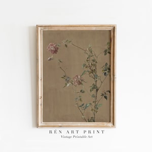 May include: A vintage botanical illustration of a rose bush with pink flowers and green leaves on a brown background. The image is framed in a light wood frame.