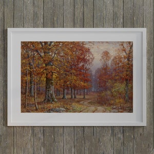 May include: A framed landscape painting depicts an autumn forest scene. The artwork showcases trees with vibrant orange and yellow foliage lining a dirt path. The painting is set in a white frame, creating a classic aesthetic.