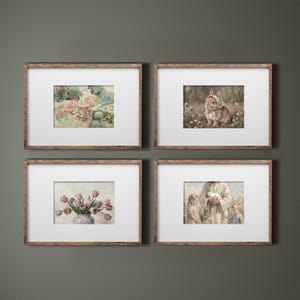 May include: Four framed art prints with watercolor illustrations. The prints feature a garden scene, a rabbit in a field, a vase of pink tulips, and a person with children holding a dove. The frames are made of wood.