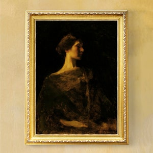 May include: A framed portrait of a woman in profile, rendered in muted tones of gold and brown against a dark background. The ornate gold frame enhances the classical aesthetic of the artwork.