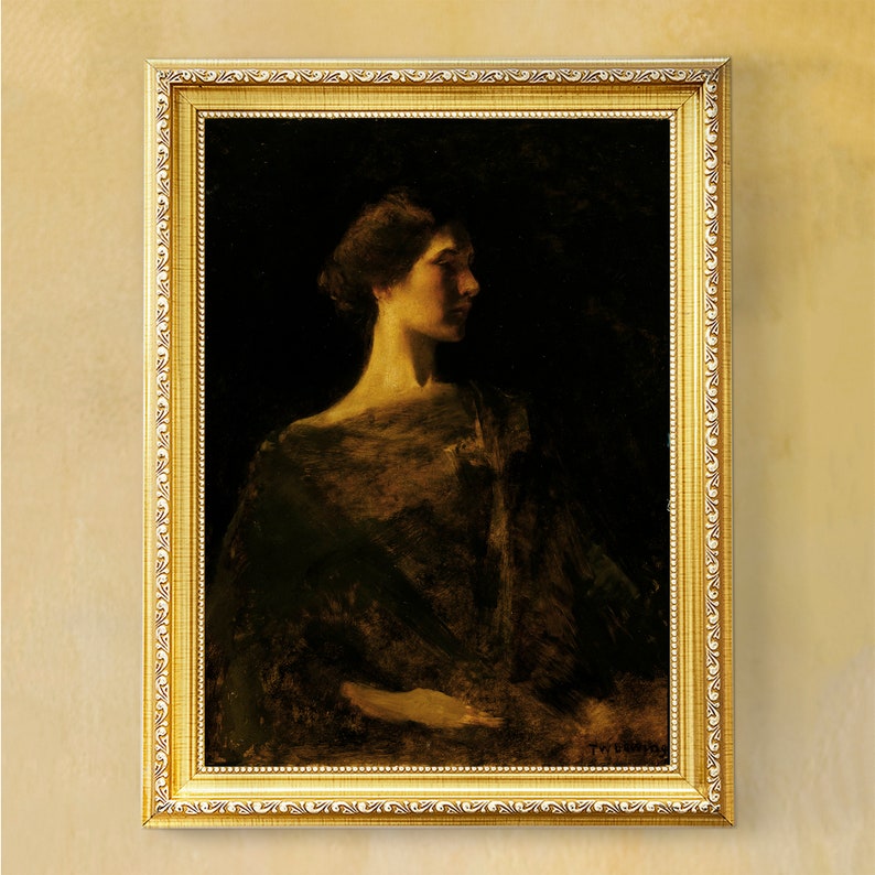 May include: A framed portrait of a woman in profile, rendered in muted tones of gold and brown against a dark background. The ornate gold frame enhances the classical aesthetic of the artwork.