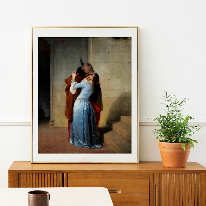 May include: A painting of a couple kissing in a doorway. The man is wearing a brown hat and a brown jacket. The woman is wearing a blue dress. The painting is set in a stone building with a staircase.