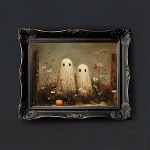 May include: A framed art print featuring two white ghost figures standing in a field of wildflowers and a small pumpkin. The artwork is set in a black ornate frame, perfect for Halloween decor.