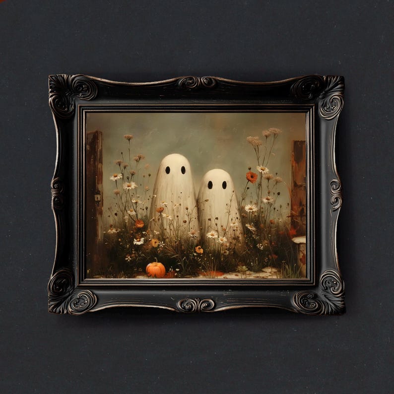 May include: A framed art print featuring two white ghost figures standing in a field of wildflowers and a small pumpkin. The artwork is set in a black ornate frame, perfect for Halloween decor.