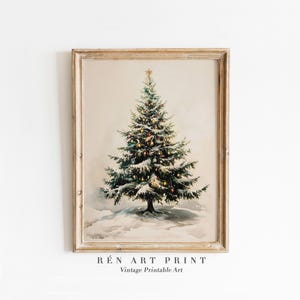 May include: A vintage illustration of a snow-covered Christmas tree with twinkling lights and red and gold baubles. The tree is framed in a light wood frame.