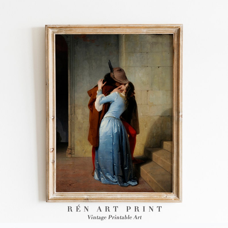 May include: A vintage painting of a couple embracing in a hallway. The man is wearing a brown coat and a hat, while the woman is wearing a blue dress. The painting is framed in a light wood frame.