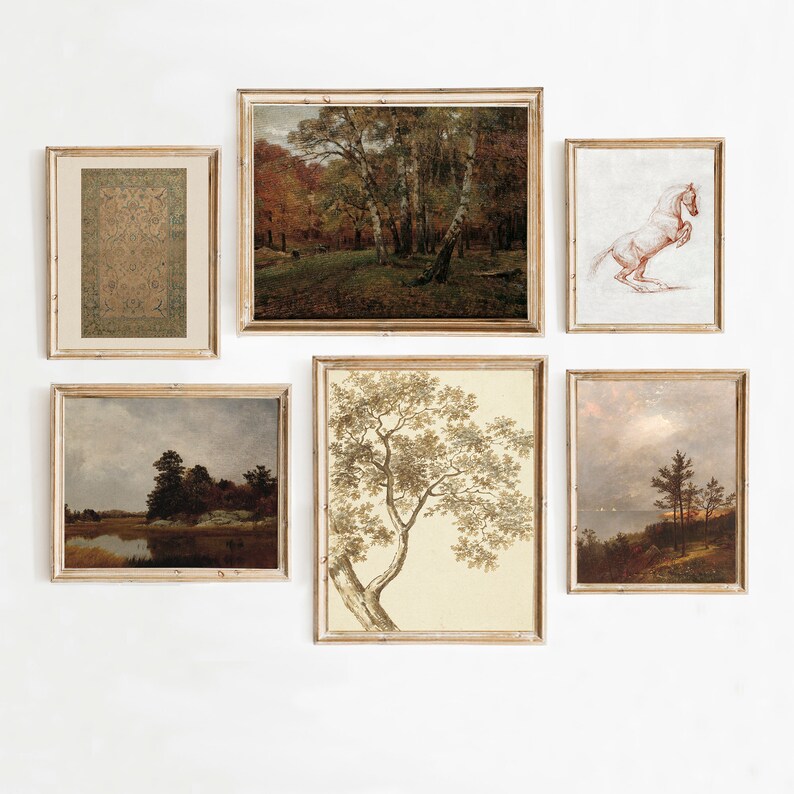 May include: A gallery wall featuring six framed prints. The prints depict a range of subjects, including landscapes, trees, and a horse. The frames are all wooden and have a light brown finish.