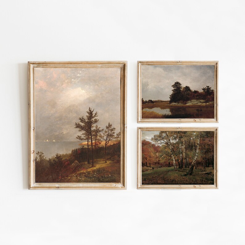 May include: Three framed landscape paintings with a rustic aesthetic. The paintings depict scenes of forests, lakes, and trees in a muted colour palette.