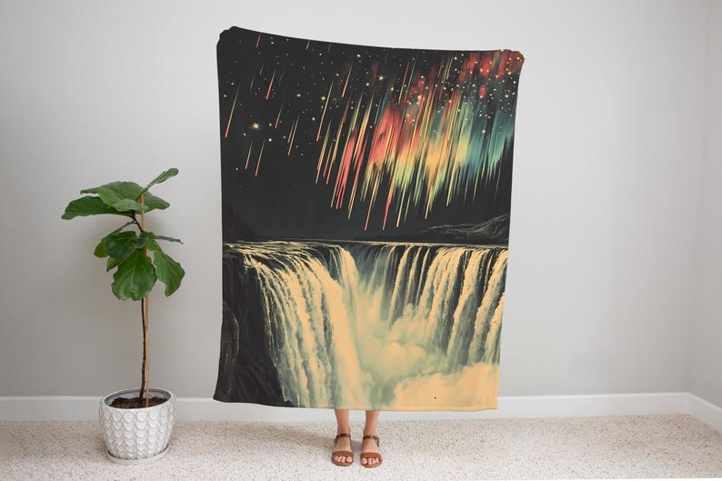 May include: A colorful tapestry featuring a waterfall with a night sky background. The sky is filled with stars and streaks of light in shades of red, yellow, green, and blue.