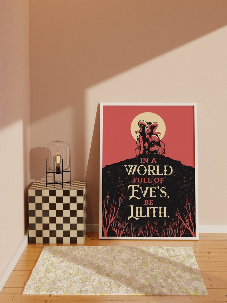 May include: A red and black poster with a woman with horns and a halo. The text reads "In a world full of Eve's, be Lilith."