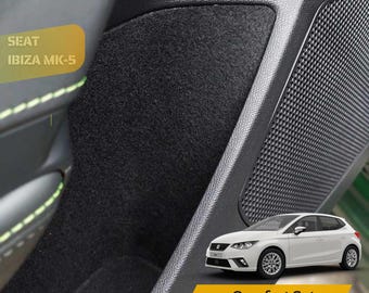 May include: Black interior car trim with a textured speaker panel and a black felt insert. The text "SEAT IBIZA MK-5" is visible. A white car with the text "Comfort Set" is also shown.