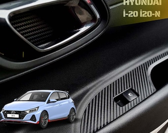 May include: Close-up of a car door interior with a carbon fiber accent panel and a window control button. The image includes a small car graphic and the text "Door Sticker". The Hyundai i-20 i20-N logo is also visible.