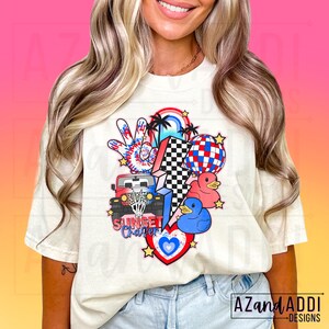 May include: A white t-shirt with a colourful graphic design featuring a jeep, a peace sign, a lightning bolt, a heart, and rubber ducks. The text "Sunset Chapter" is included in the design.