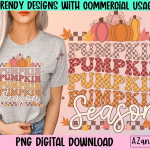 May include: A light gray t-shirt with a pumpkin-themed design. The design features the words "Pumpkin Season" in a retro font, with pumpkins and fall leaves. The text "Trendy Designs with Commercial Usage" is at the top.
