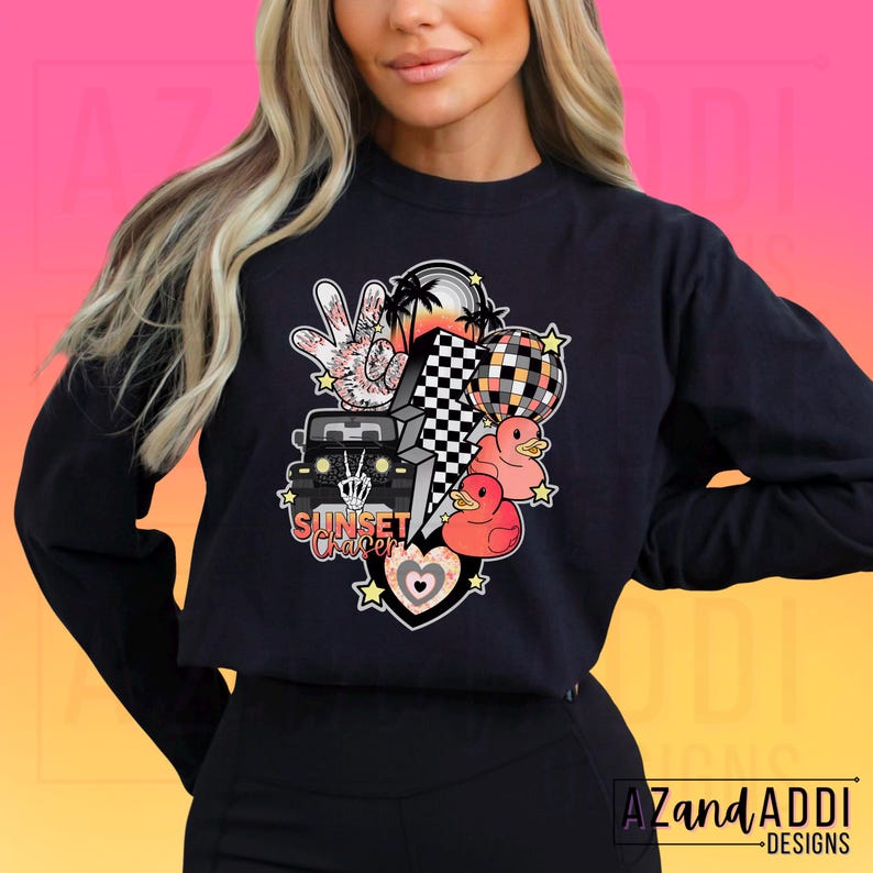 May include: Black sweatshirt with a graphic design featuring a jeep, palm trees, a peace sign, a chequered flag, ducks, and the text "Sunset Chaser".